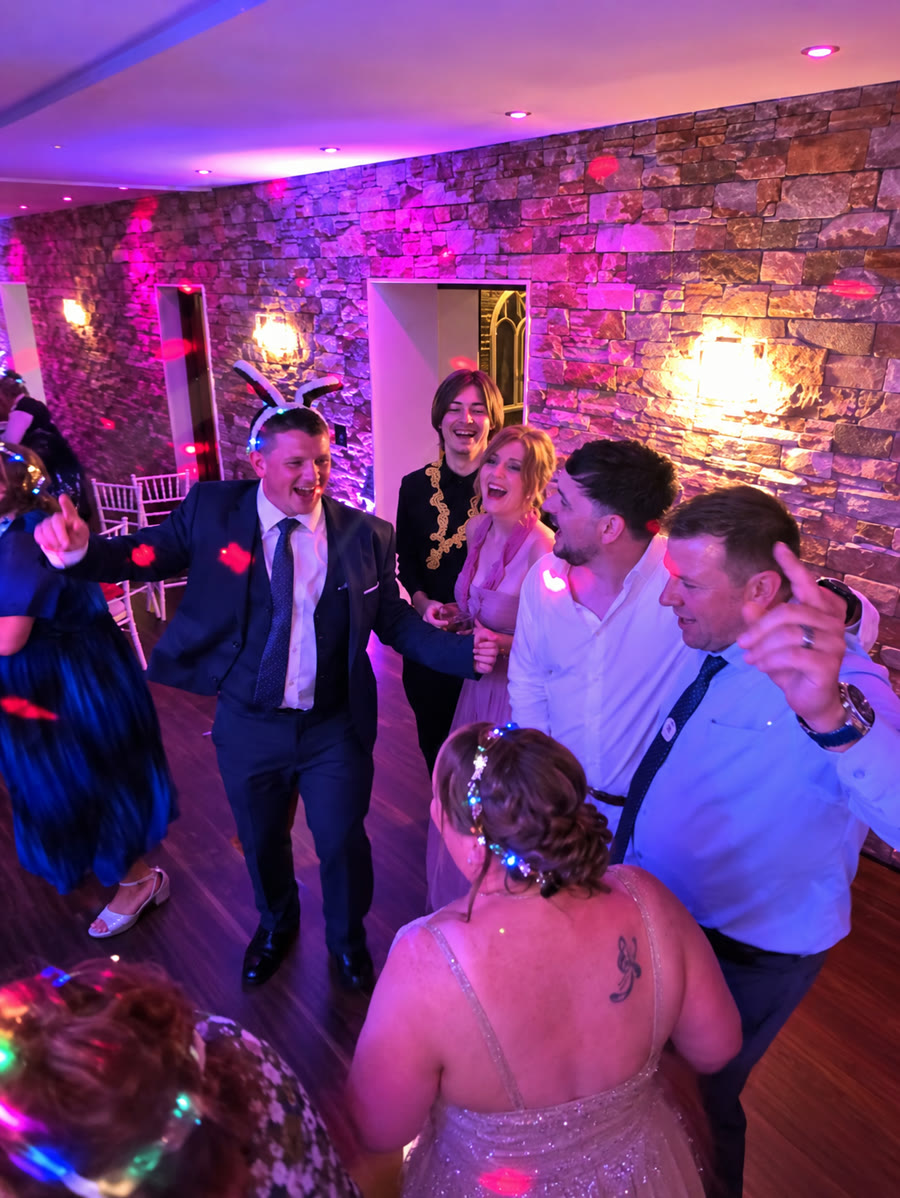 Guests dancing together at a party celebration