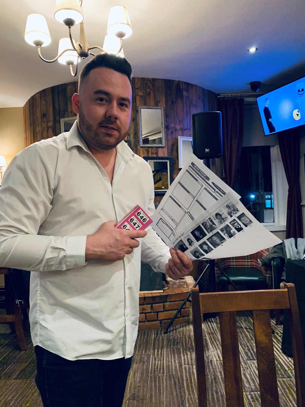 Andy with picture-round and bingo materials for a hosted quiz night